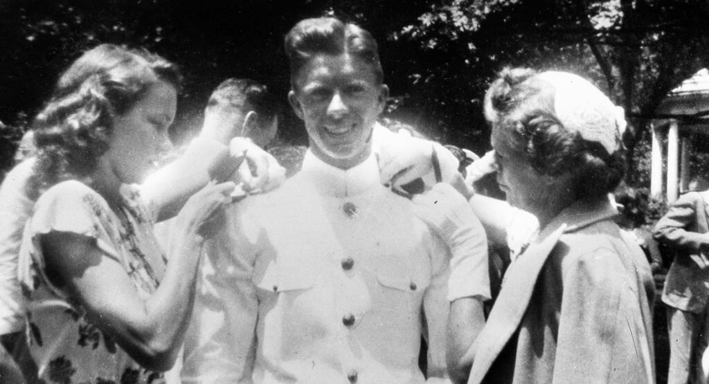 Jimmy Carter gets his bars pinned on by his wife Rosalynn, left and his mother, Mrs. Lillian Carter at the U.S. Naval Academy in this undated photo. (AP Photo)